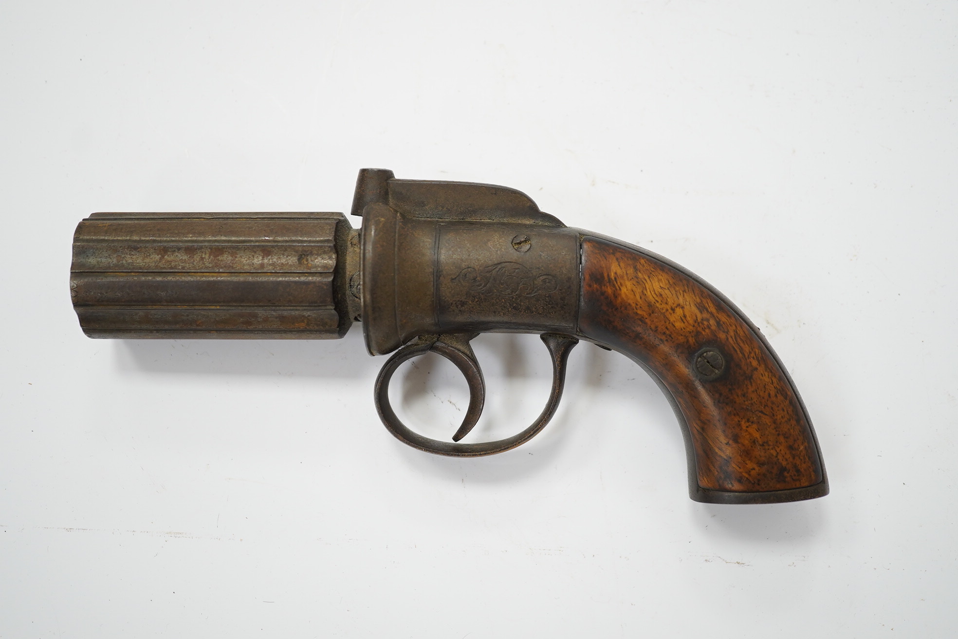 A six shot self-cocking percussion pepper box revolver, Birmingham proofs, foliate engraved round frame and two piece walnut grips, barrel 7cm. Condition - fair